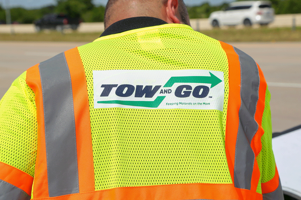 image of tow and go logo on wrecker driver jacket
